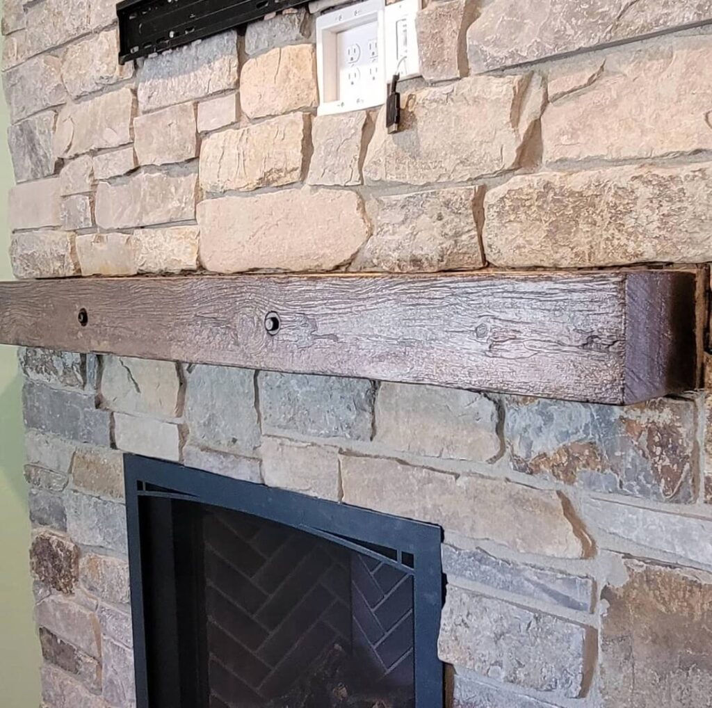 Thick mantel on brick wall above fireplace - KreteworX Idaho falls mantel.