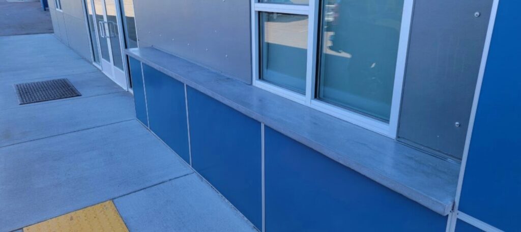 Commercial shelf of concrete on blue exterior by KreteworX of Idaho in Idaho Falls.