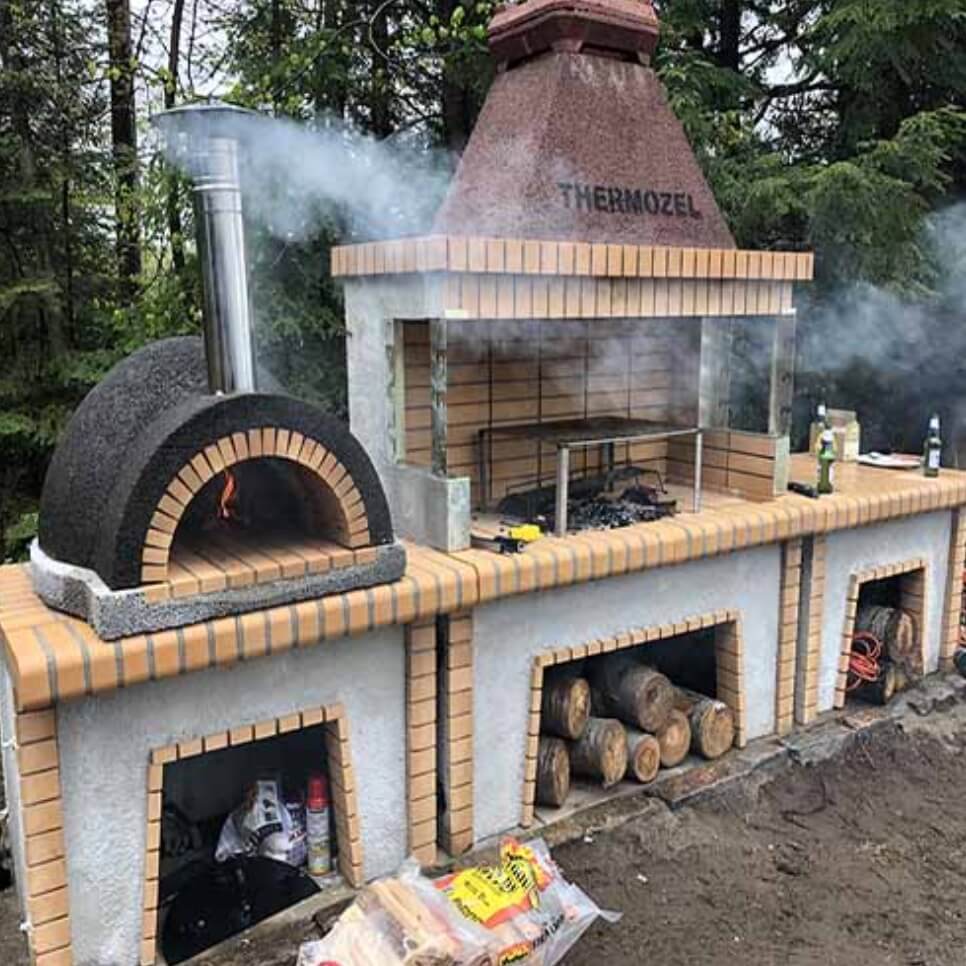 Custom brick and concrete outdoor kitchen and fire ovens - Idaho Falls outdoor kitchens KretworX